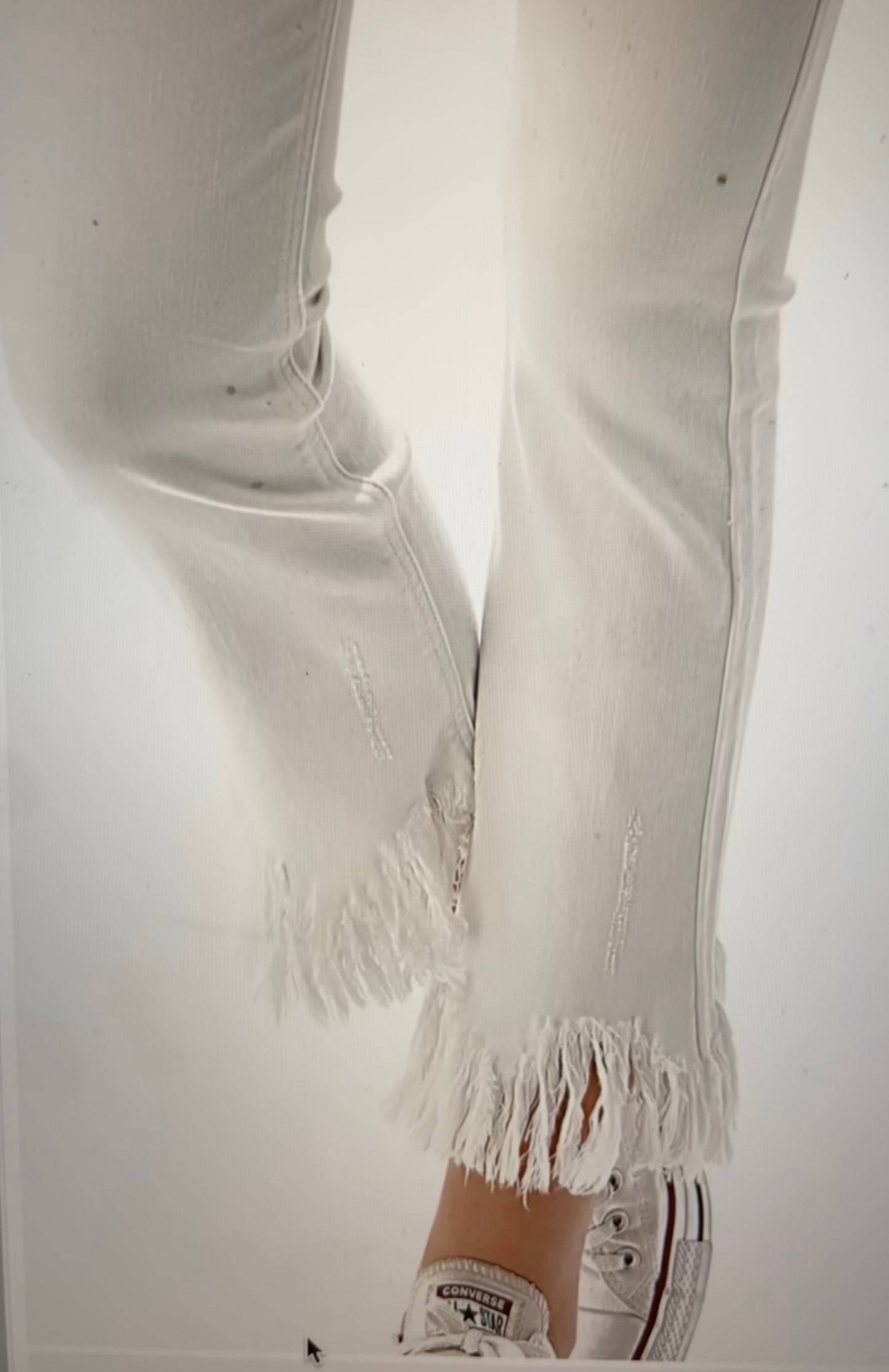Solid white color fashion denim jeans with frayed edge